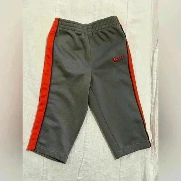 Nike - grey and orange track pants. Size 9  months - Picture 1 of 2